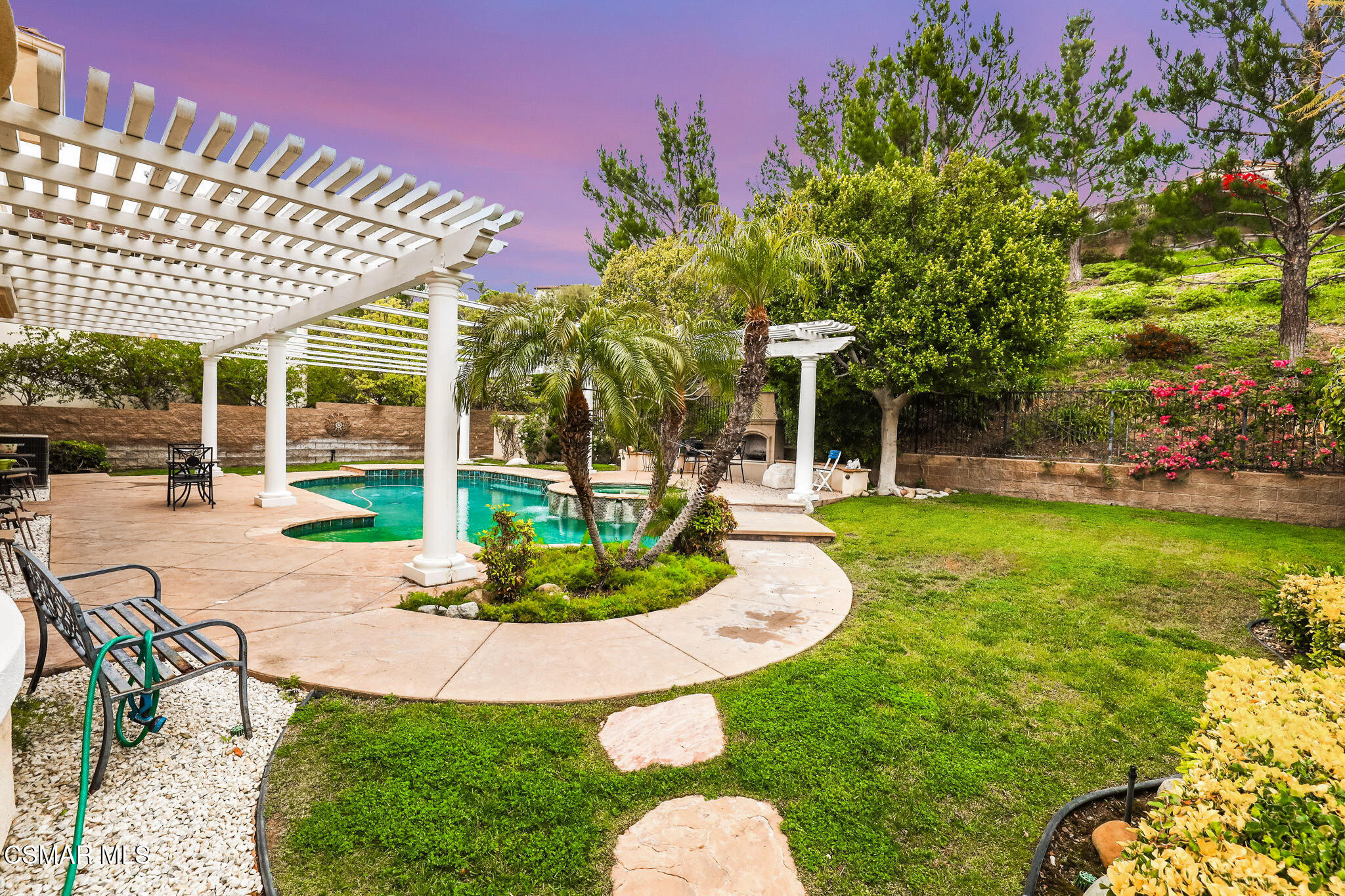 20253 Vía Galileo Porter Ranch, CA 91326 - Photo 41 of 41 a patio with a yard table and chairs