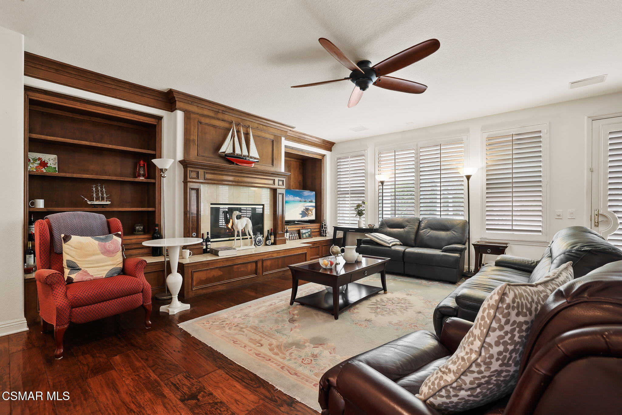 20253 Vía Galileo Porter Ranch, CA 91326 - Photo 6 of 41 a living room with furniture ceiling fan and a window