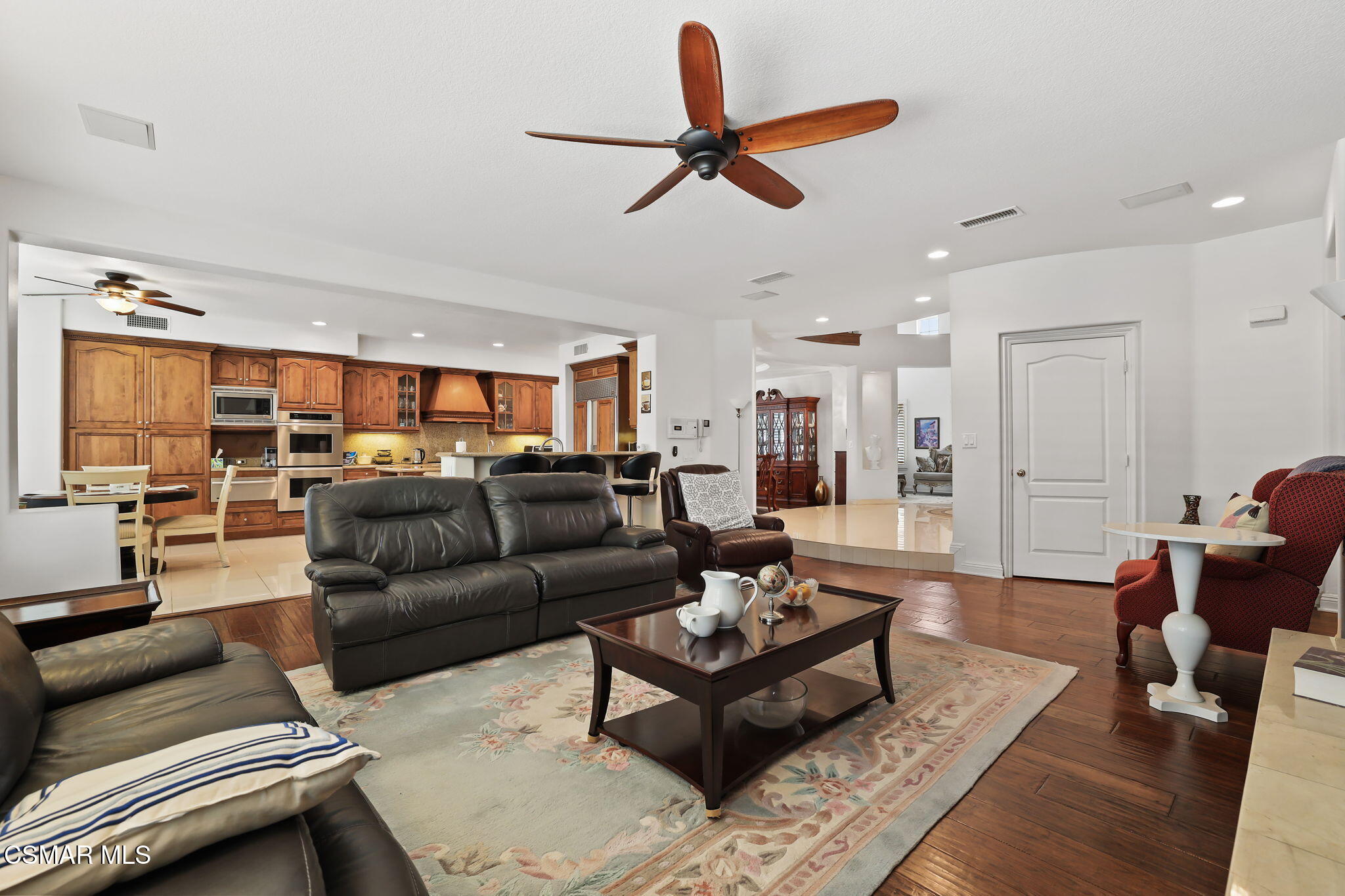 20253 Vía Galileo Porter Ranch, CA 91326 - Photo 7 of 41 a living room with furniture kitchen view and a window