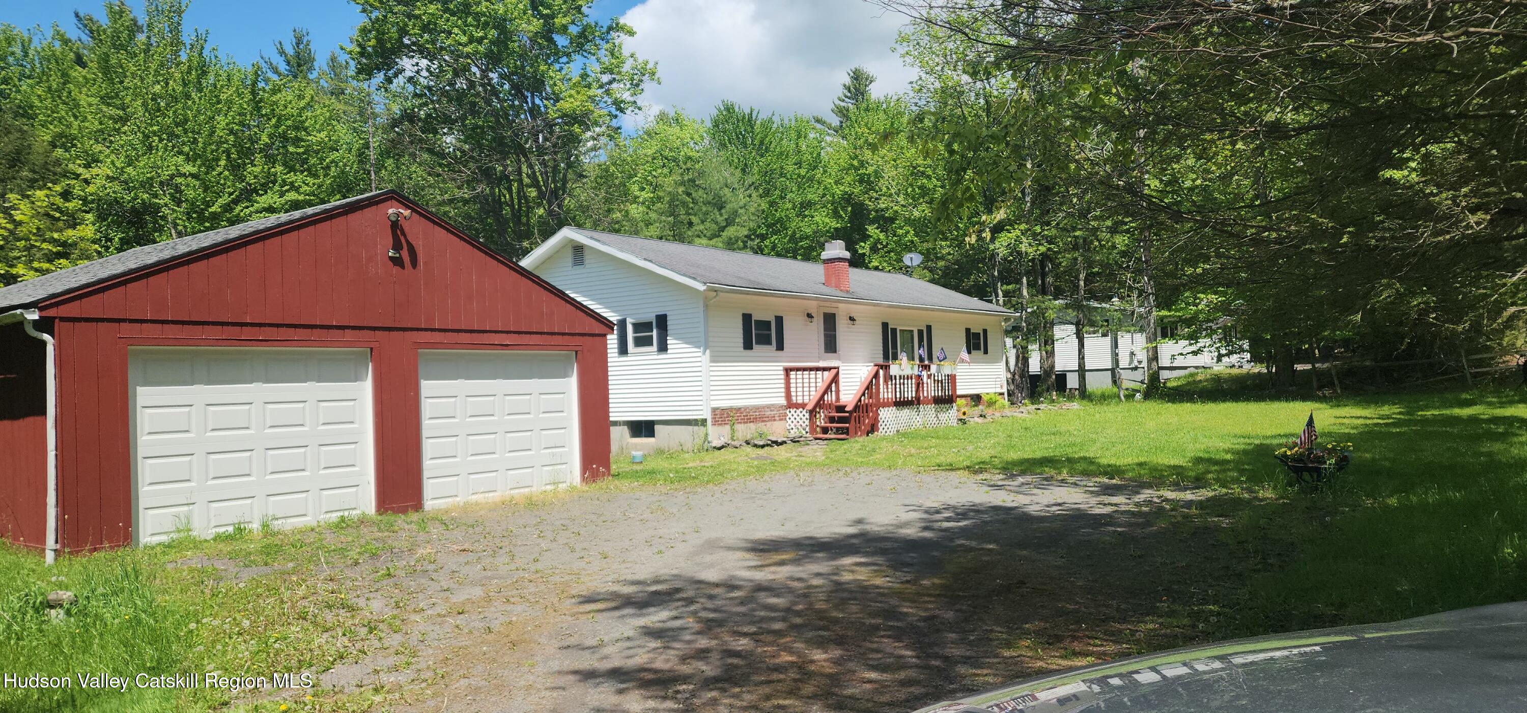 315 Begley Road Windham, NY 12496 - Photo 1 of 22 a front view of a house with a yard and garage