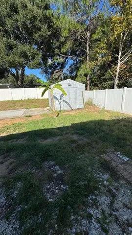 a view of a yard with an outdoor space
