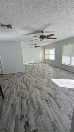 a view of a livingroom with wooden floor