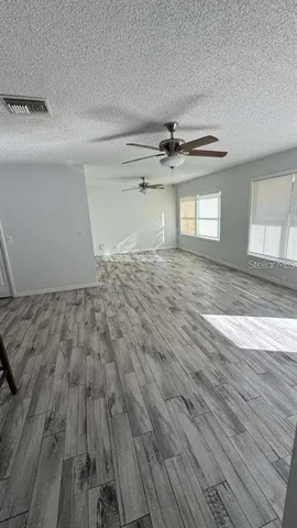 a view of a livingroom with wooden floor