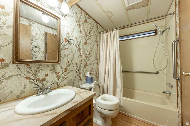 1360 North Dixie Downs Road, Unit 4 St. George, UT 84770 - Photo 8 of 22 Bathroom featuring a vanity with an oval basin, wood-finish cabinetry, and a framed mirror