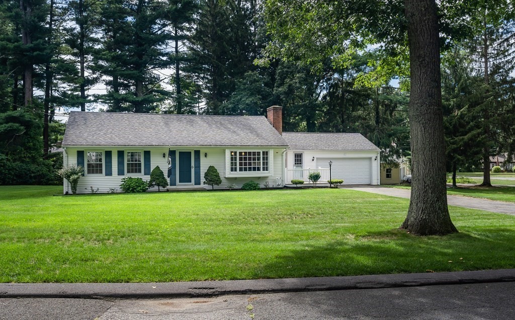 2 East Colonial Road Wilbraham, MA 01095 - Photo 1 of 42 a front view of a house with a garden