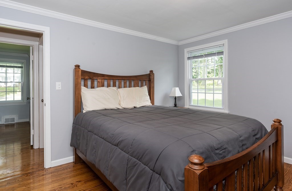 2 East Colonial Road Wilbraham, MA 01095 - Photo 18 of 42 a bedroom with a bed and wooden floor