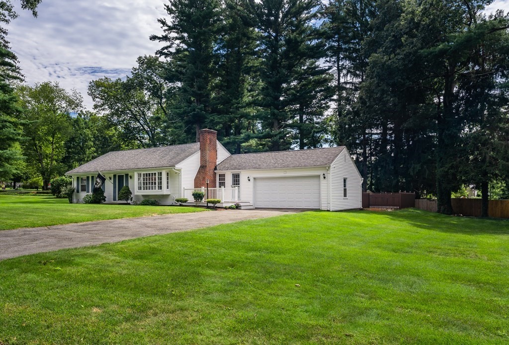 2 East Colonial Road Wilbraham, MA 01095 - Photo 2 of 42 a front view of a house with garden