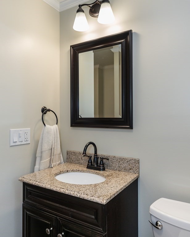 2 East Colonial Road Wilbraham, MA 01095 - Photo 23 of 42 a bathroom with a granite countertop sink and a mirror