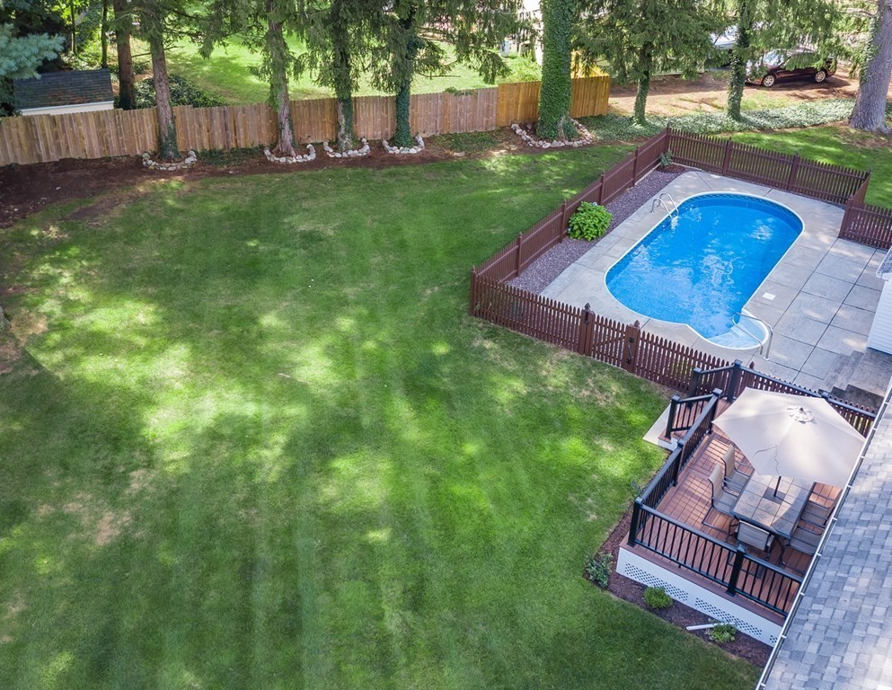 2 East Colonial Road Wilbraham, MA 01095 - Photo 32 of 42 a backyard of a house with table and chairs