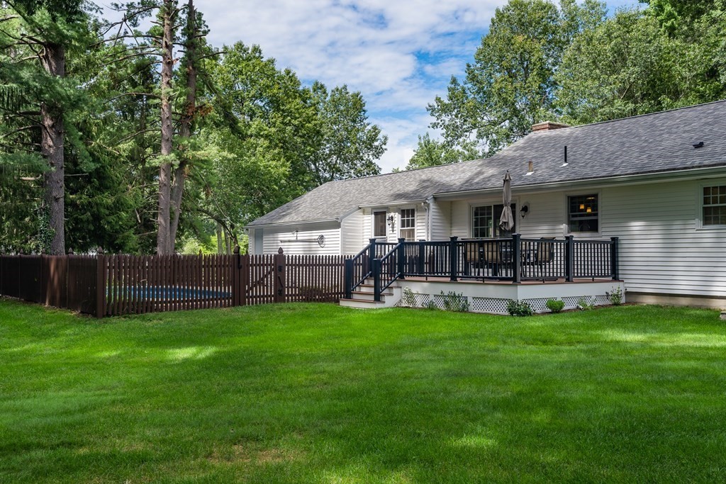 2 East Colonial Road Wilbraham, MA 01095 - Photo 35 of 42 a view of a patio with table and chairs under an umbrella