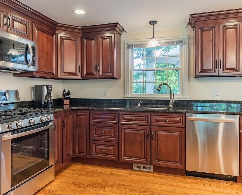 2 East Colonial Road Wilbraham, MA 01095 - Photo 8 of 42 a kitchen with stainless steel appliances granite countertop a stove a sink and a microwave