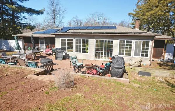 a view of a dinning table and chairs in the patio