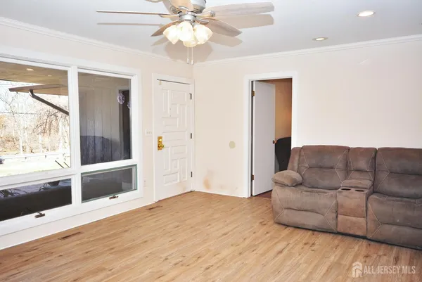a living room with furniture and a large window