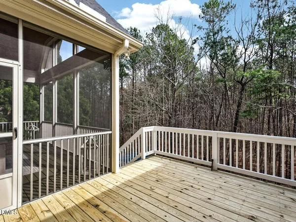 a view of a house with backyard sitting area and garden
