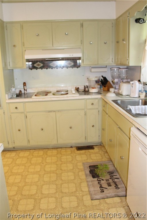 3997 Lovette Road Lumberton, NC 28358 - Photo 15 of 28 a kitchen with granite countertop cabinets sink and a stove