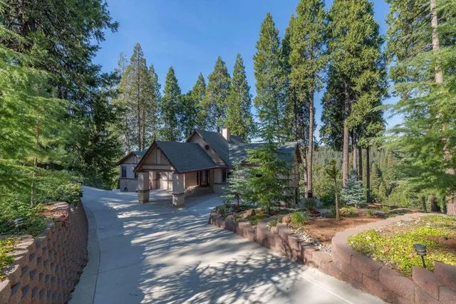 a view of a patio with furniture and a yard