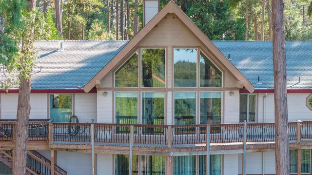 a kitchen with stainless steel appliances granite countertop a refrigerator sink and stove