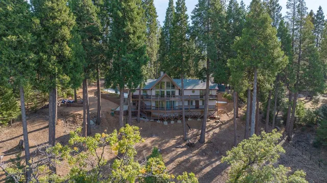 a kitchen with stainless steel appliances kitchen island sink stove and cabinets