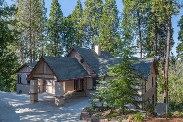 front view of a house with a tree