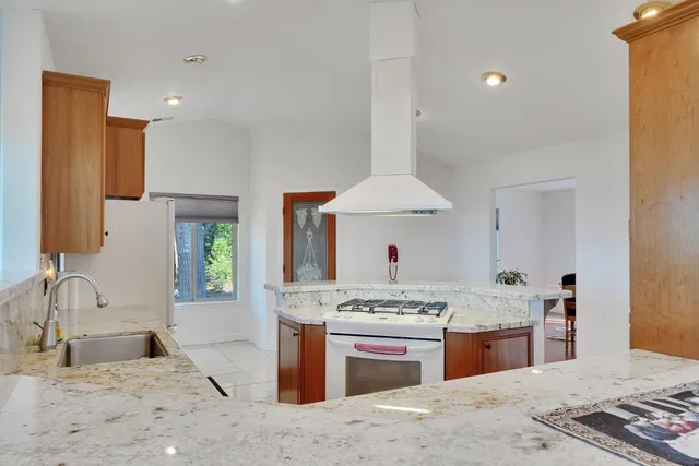 a bedroom with a bed and a dresser in it