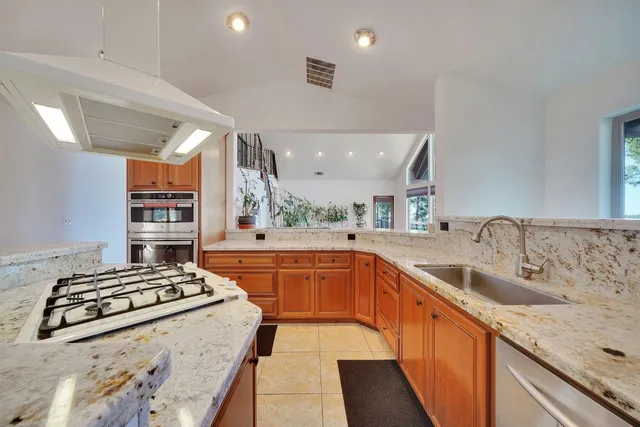 a bedroom with bed and a chandelier