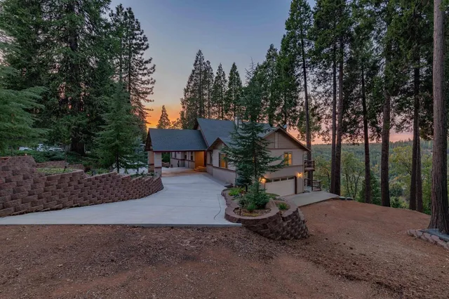 a front view of a house with trees