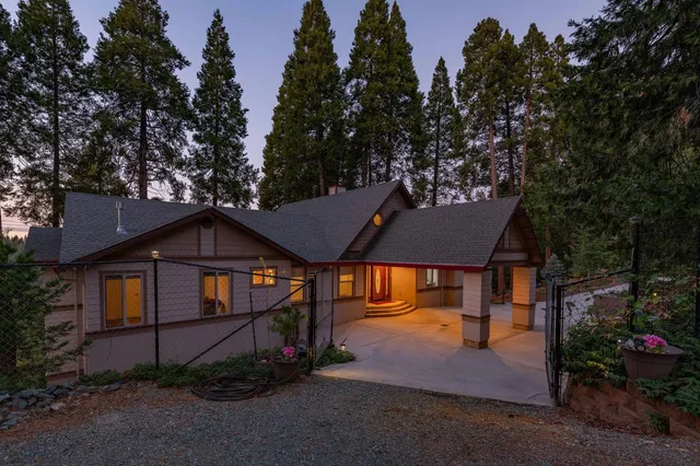 an aerial view of house with yard