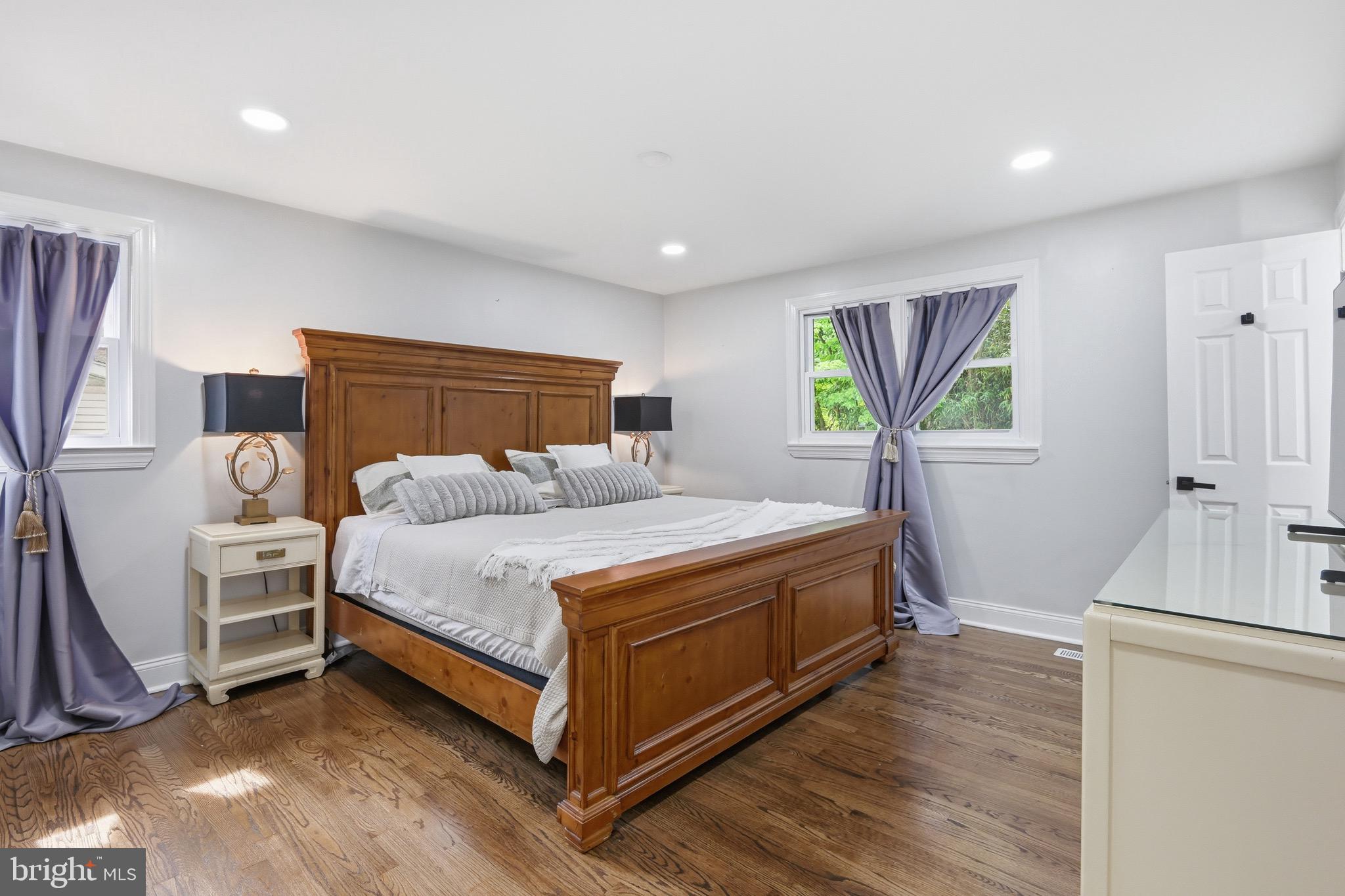 238 East Timonium Road Lutherville-Timonium, MD 21093 - Photo 21 of 40 a spacious bedroom with a bed and a flat screen tv