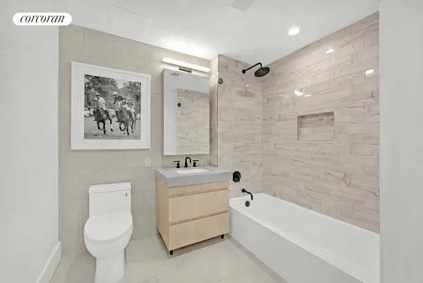 a bathroom with a toilet a sink and bathtub