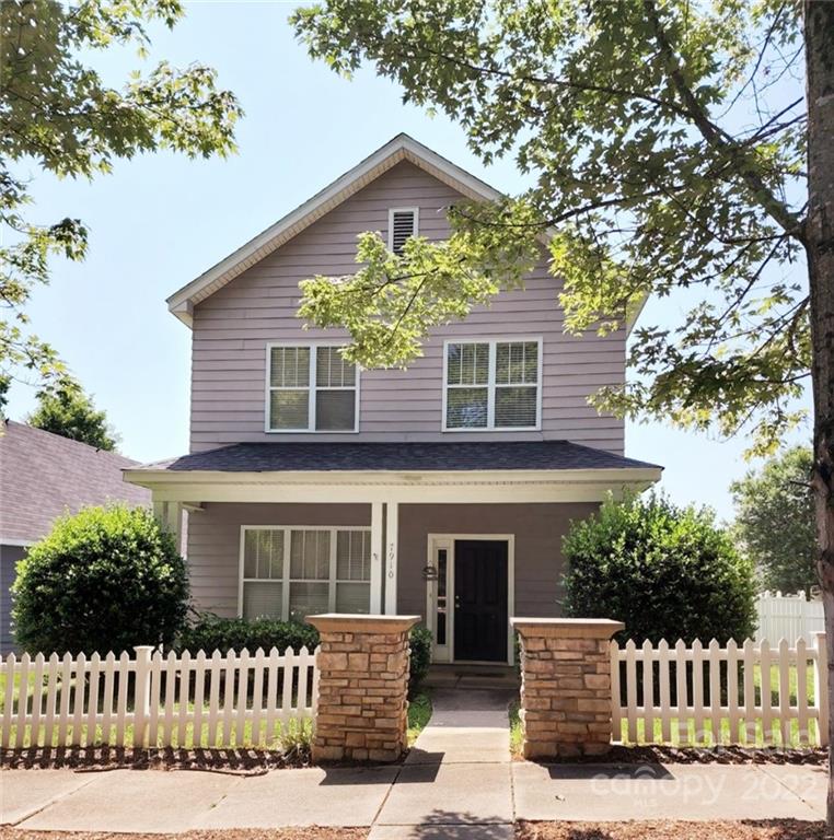 front view of a house with a small yard