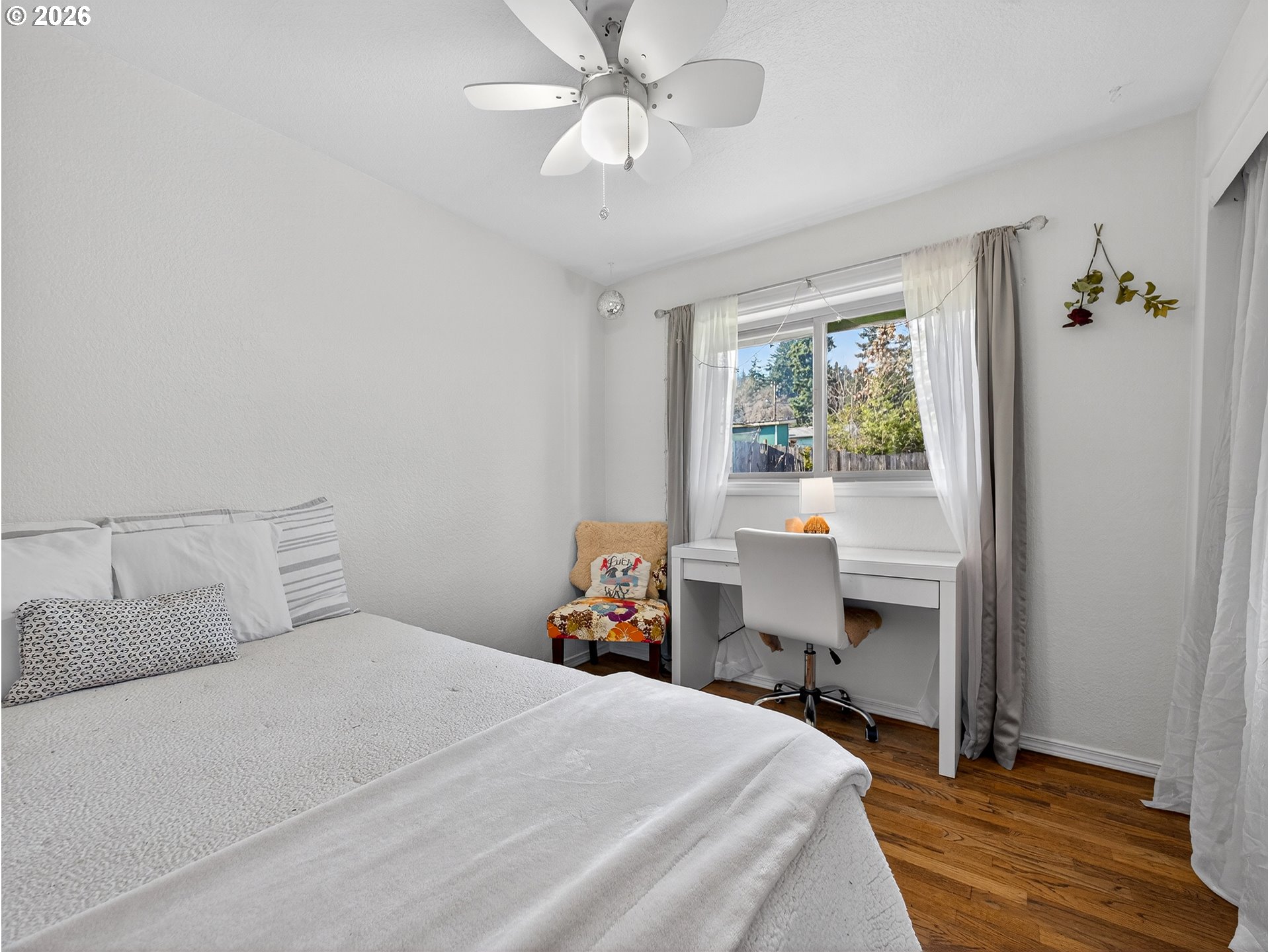 2230 Cleveland Street Eugene, OR 97405 - Photo 20 of 37 a bedroom with a bed and a table