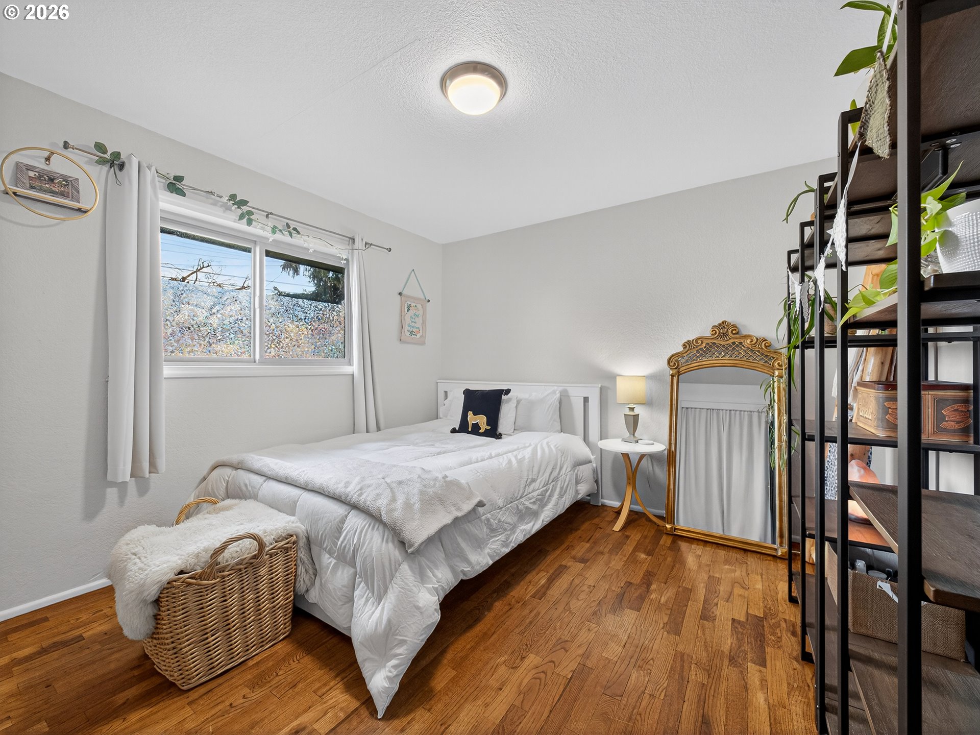 2230 Cleveland Street Eugene, OR 97405 - Photo 22 of 37 a spacious bedroom with a bed table and a window