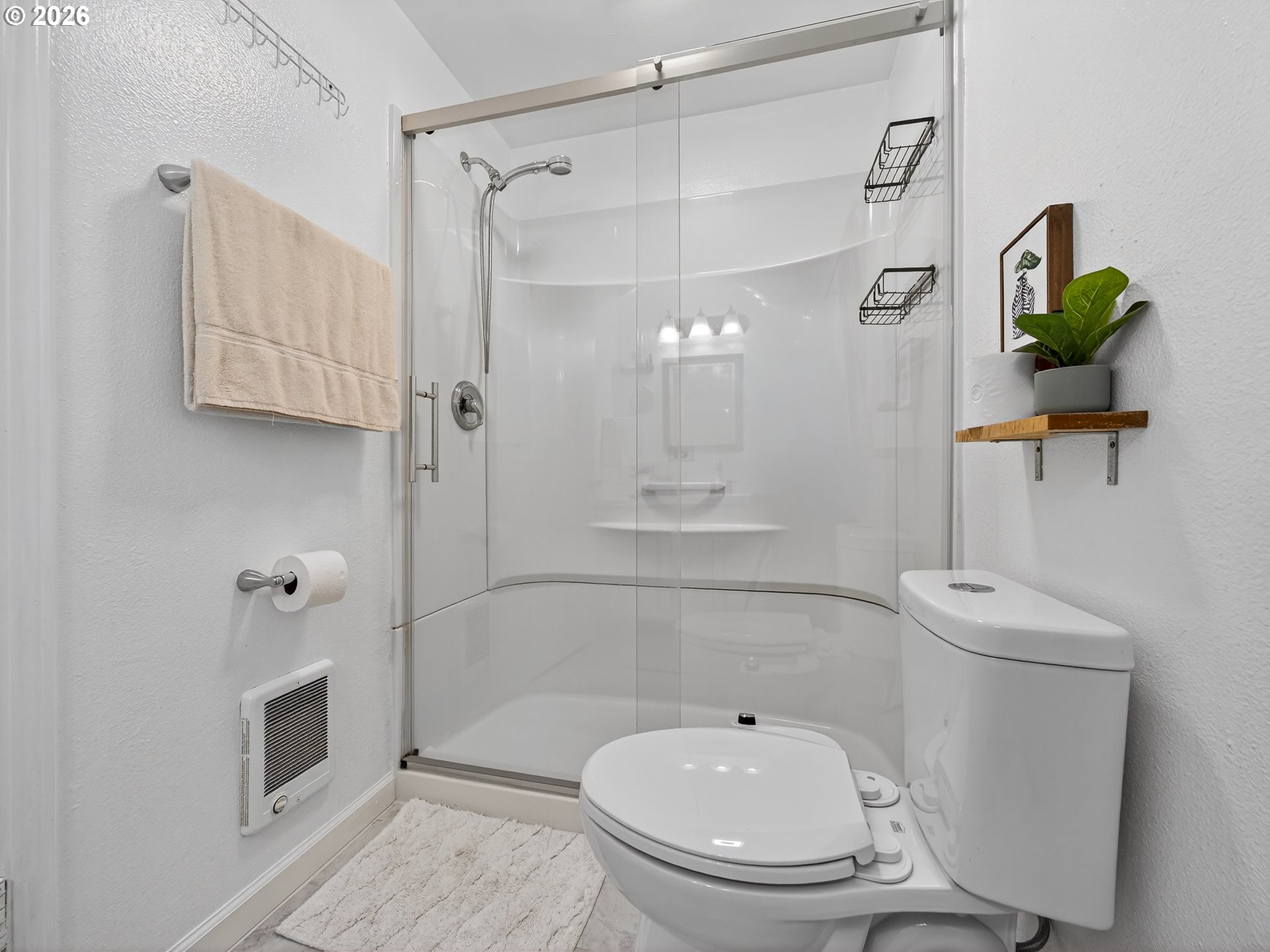 2230 Cleveland Street Eugene, OR 97405 - Photo 24 of 37 a bathroom with a toilet a sink and shower