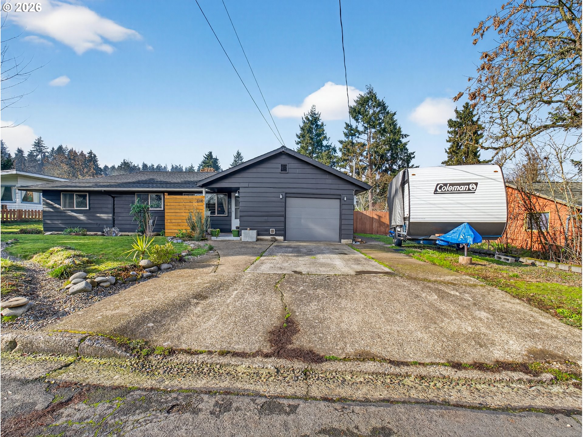 2230 Cleveland Street Eugene, OR 97405 - Photo 3 of 37 a front view of a house with a yard and garage