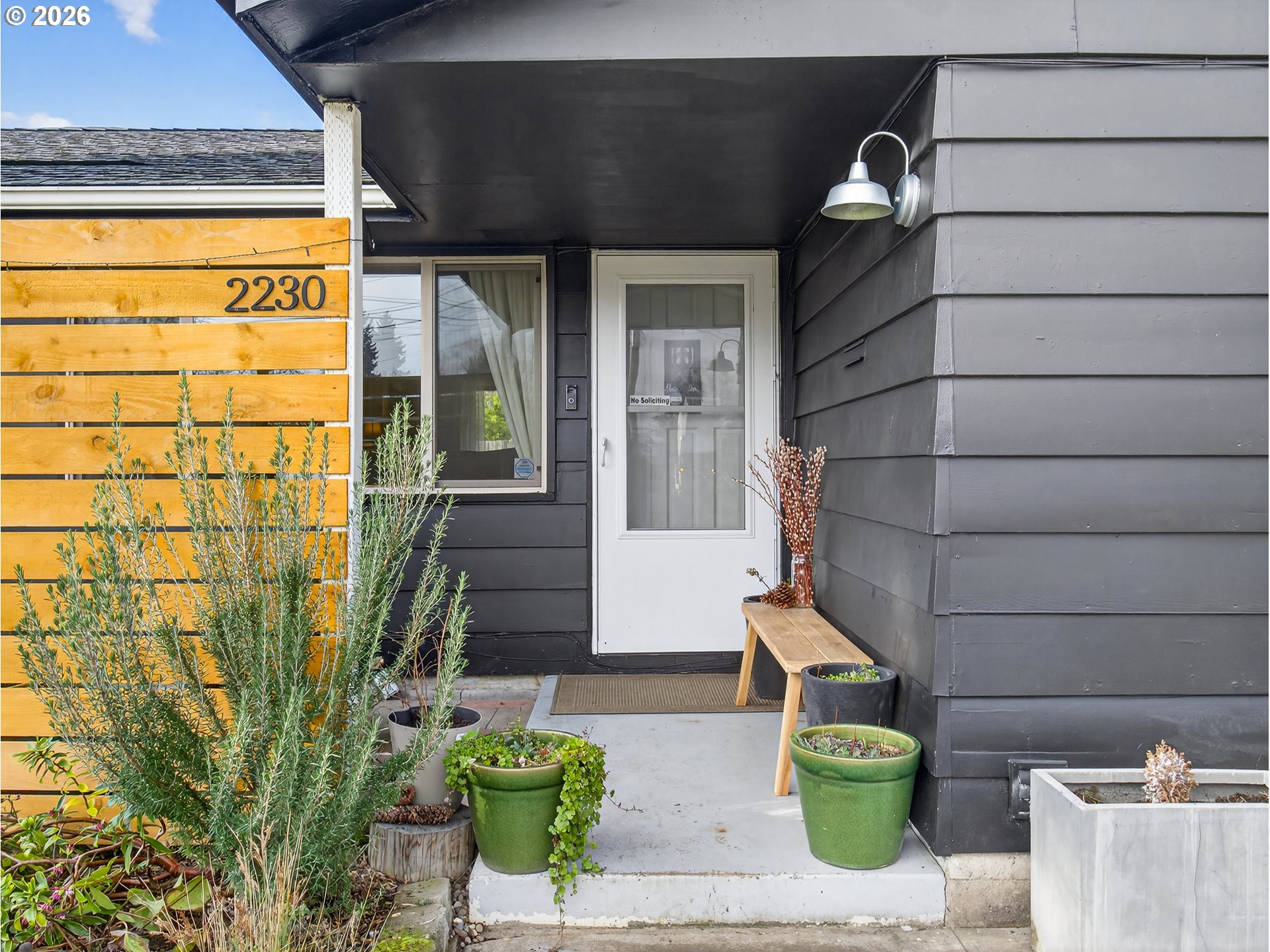 2230 Cleveland Street Eugene, OR 97405 - Photo 7 of 37 a front view of a house with outdoor seating
