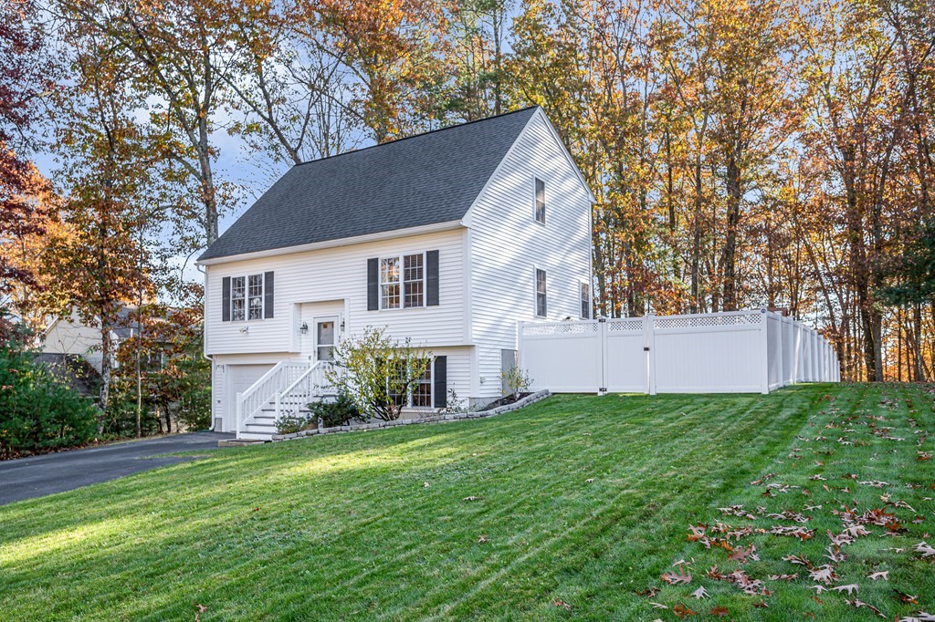 46 Parham Road Tyngsboro, MA 01879 - Photo 1 of 36 a view of backyard with garden