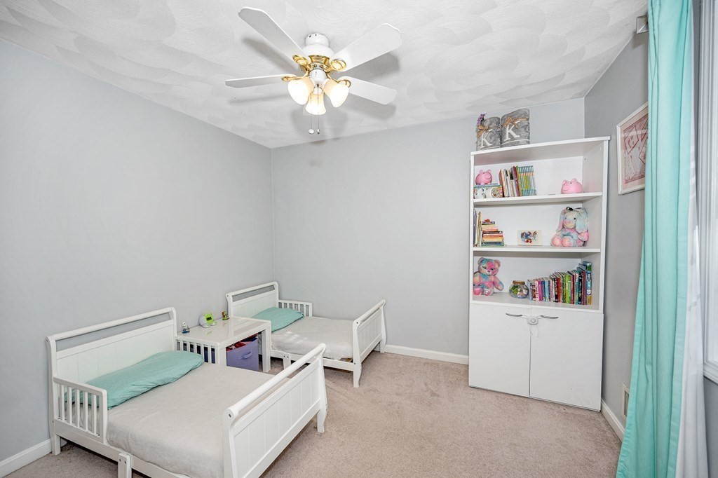 46 Parham Road Tyngsboro, MA 01879 - Photo 20 of 36 a living room with furniture and a window