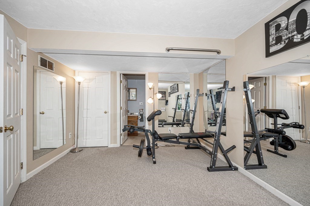 46 Parham Road Tyngsboro, MA 01879 - Photo 25 of 36 a view of a room with gym equipment
