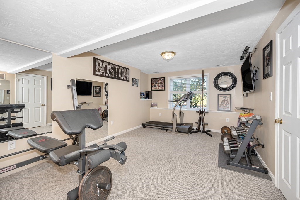 46 Parham Road Tyngsboro, MA 01879 - Photo 27 of 36 a view of a room with gym equipment