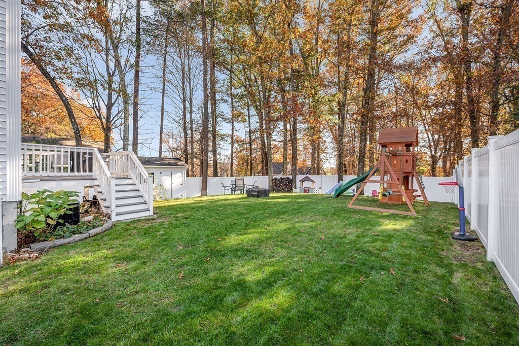 46 Parham Road Tyngsboro, MA 01879 - Photo 28 of 36 a view of a house with a backyard and a tree