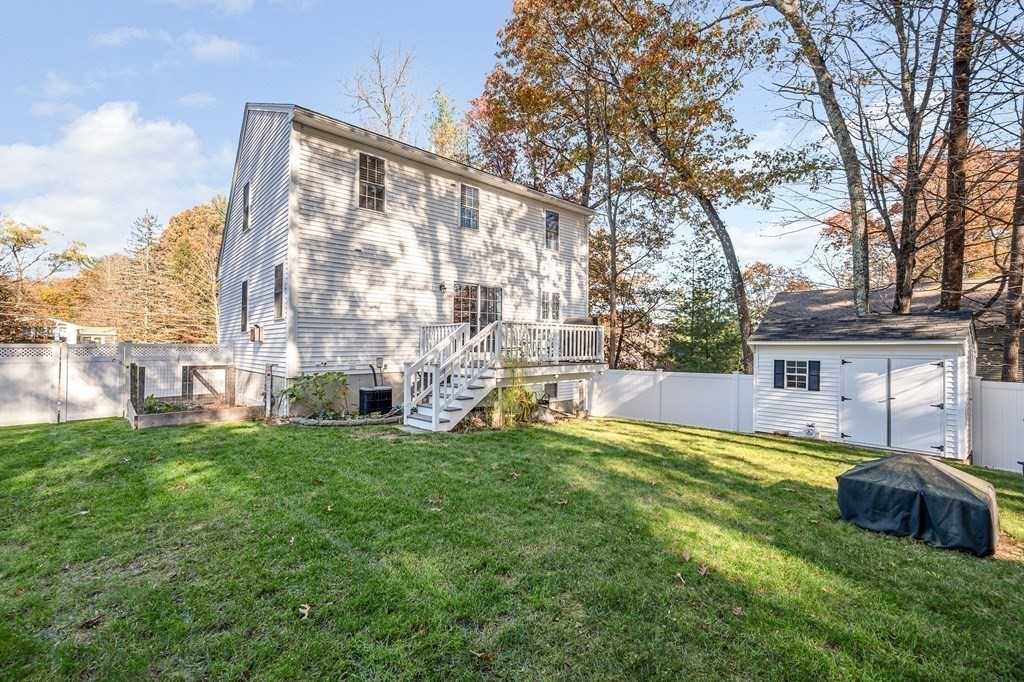 46 Parham Road Tyngsboro, MA 01879 - Photo 31 of 36 a view of a house with a big yard and large trees