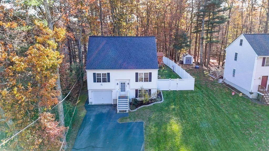46 Parham Road Tyngsboro, MA 01879 - Photo 33 of 36 a view of house with backyard