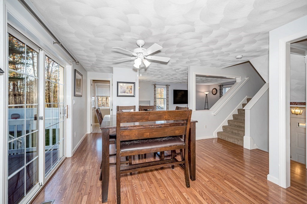 46 Parham Road Tyngsboro, MA 01879 - Photo 6 of 36 a living room with furniture a fireplace and wooden floor