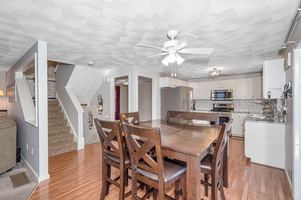 46 Parham Road Tyngsboro, MA 01879 - Photo 9 of 36 a view of a dining room with furniture and wooden floor