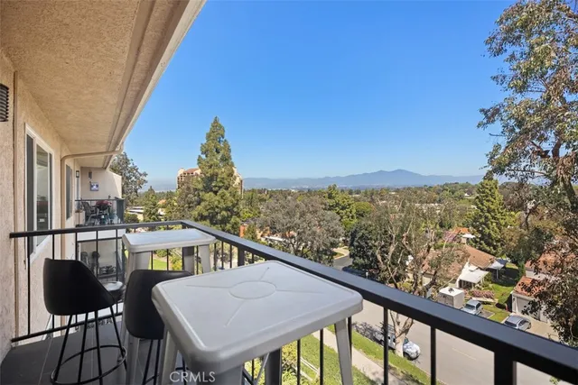 a view of a balcony with chairs