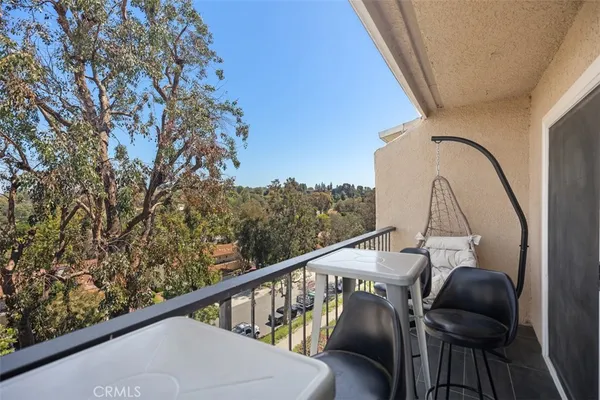 a view of balcony with furniture