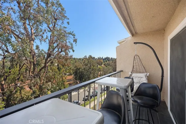 a view of balcony with furniture
