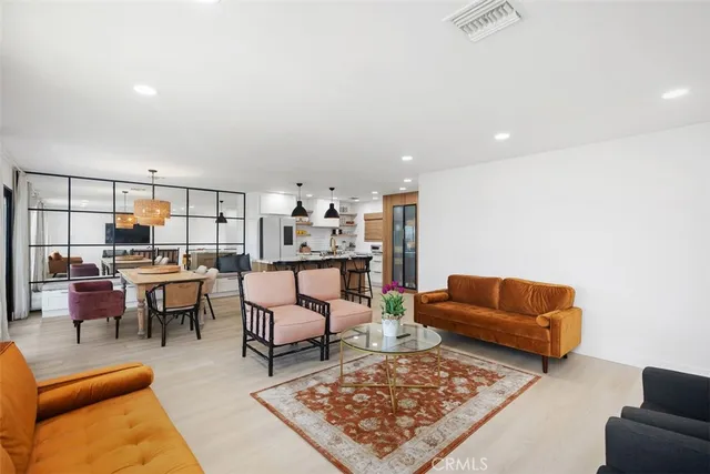 a living room with furniture and a rug