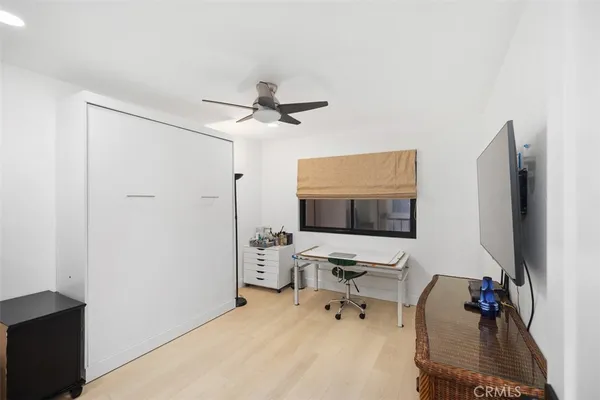 a workspace with furniture and a flat screen tv