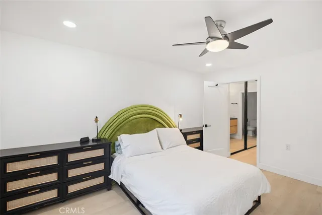 a bedroom with a bed and dresser